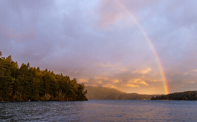 Scenic Rainbow Over Vancouver Island at Sunset