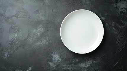 A white plate on a black background.