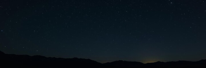 Majestic mountain landscape under a starry night sky, majestic, night sky
