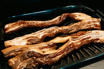 Grilling a pork belly liempo in a Ninja Foodie indoor grill. This is a famous Filipino delicacy.