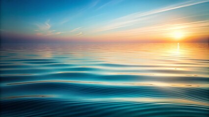 Obraz premium Serene Sunset Over Calm Ocean Water with Gentle Waves Reflecting Golden Hues