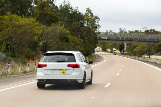 L plate driver driving car on divided highway in Australia