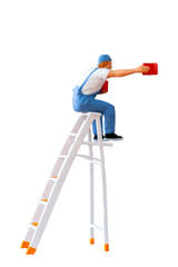 A miniature figurine of a painter seated on a ladder, holding a paint can and brush.isolate on white back ground with clipping path