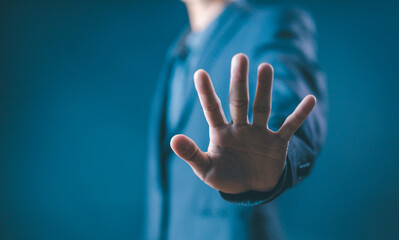 person's hand showing palm gestures stop, concept violence, warning, refuse, defense, caution. the...
