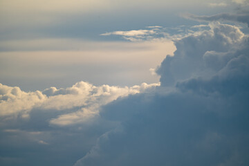 Fototapeta premium Dramatic cloudscapes fill the sky, showcasing nature's artistry with a breathtaking display of textures and colors. 