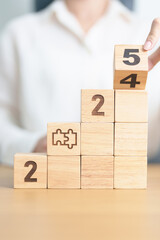 2024 year change to 2025 year block with jigsaw puzzle icon. Business Process, Team, teamwork,...