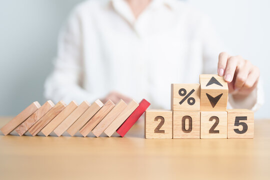 block falling on 2025 year and percentage UP and Down arrow. Interest rate, GDP, stocks market, financial, deflation and Inflation, mortgage, debt, Loan, crisis, risk and Economic Recession concept