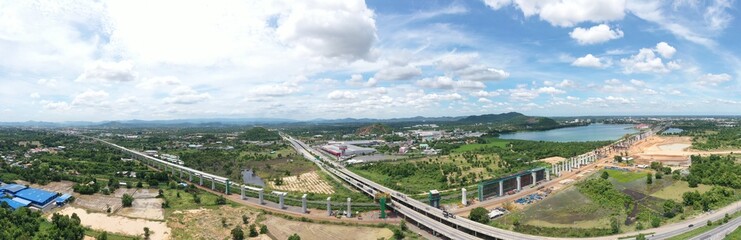 Obraz premium New construction site with crane and mechanical equipments on blue sky background, Infrastructure of high-speed train construction site of Chinese made FuxingHao, base from CR400AF for transportation.
