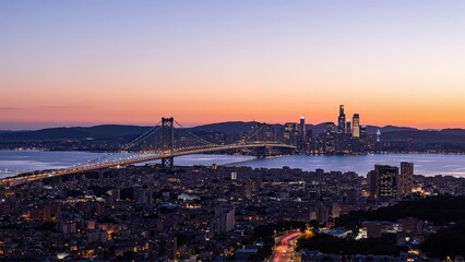 Naklejka premium Generative AI, Sprawling Urban Skyline with a Suspension Bridge at Sunset
