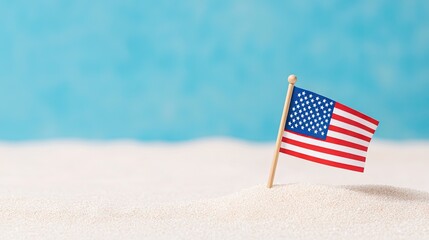 Waving USA flag on white sandy beach with tranquil blue ocean backdrop showcasing summer freedom and patriotism