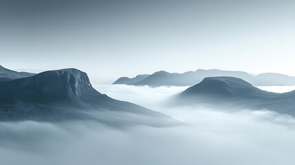 Fototapeta premium A serene shot of a fog-covered valley with mountain tops peeking through in the distance