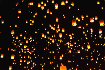 Colorful fire Lanna lantern reasing into sky during Loi Kratong festival in Chiangmai © Jack Tamrong