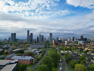 Naklejka premium Aerial View of Buildings at Greater Manchester Central City, Northwest of England, United Kingdom. Aerial View Footage Was Captured with Drone's Camera on May 4th, 2024 During Sunset Time.