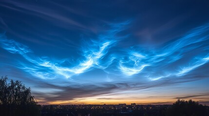 Obraz premium Twilight Cityscape: Urban Lights Amidst Nature's Glow