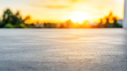 Sunset over empty concrete surface.