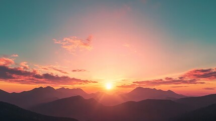 Fototapeta premium Majestic Sunset Skyscape Over Silhouetted Mountains - Perfect for Adventure Themes