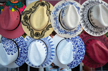 Hats, hand painted, for sale at market