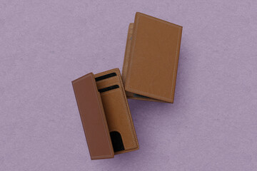 Blank leather wallet brown fold mock up, isolated, 3d rendering. Empty fabric clutch mock up front view V1