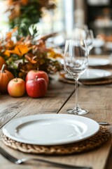 A festive Thanksgiving table with plates and silverware neatly set. A centerpiece of apples