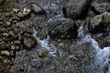 Obraz premium Beautiful, aesthetic and artistic river rocks with clear water in rural Asia Indonesia