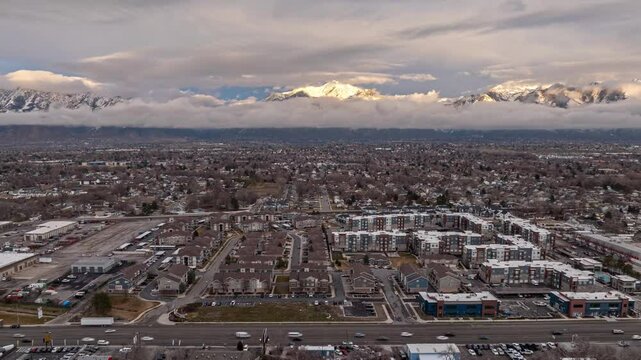 Hyperlapse over State Street in Midvale Utah and mountains getting cover with clouds