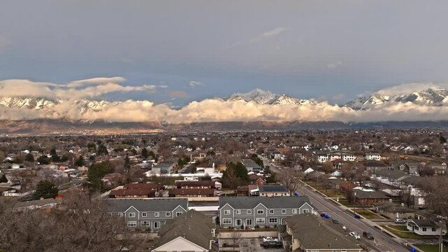 Flying over beautiful Midvale Utah neighborhood with mountain views