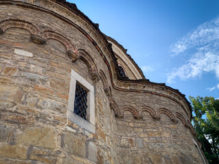 Saint Nikola Church in Dryanovo, Bulgaria, stands proudly with its intricate stone masonry and arched details, capturing the essence of historical Bulgarian architecture under a clear blue sky.