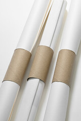 Lifehacks; keep the papers from unrolling with a toilet paper tube slit lengthwise down the middle   