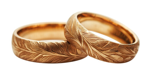 Engraved gold wedding rings with natural pattern, isolated on transparent cutout background