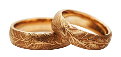 Engraved gold wedding rings with natural pattern, isolated on transparent cutout background