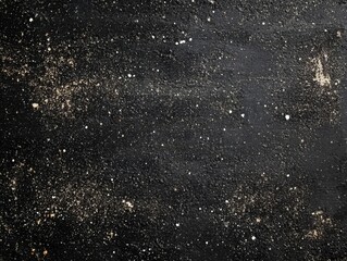 Black distressed background with white particles.