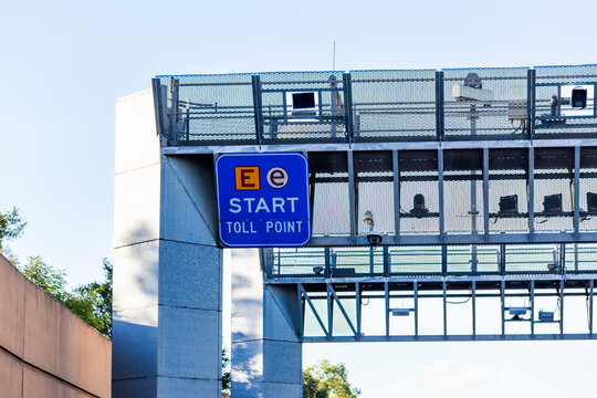 E-tag toll road start sign above highway with licence plate cameras