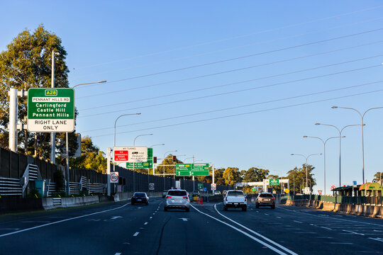 Highway in Sydney with many road signs towards north connex tunnel on M11