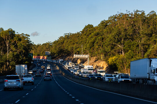 Busy multi lane highway road in approaching Sydney with traffic bumper to bumper