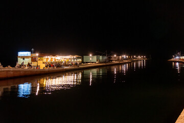 Fototapeta premium canal on the sea at night in Cesenatico Rimini Riviera Romagnola Italy