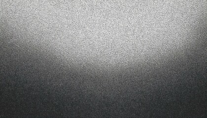 Obraz premium A textured grayscale gradient pattern with a dotted or stippled appearance transitioning from light to dark.