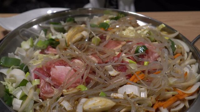 Korean food cooking wheat noodle kalbi pork belly fired on pan Korea large style 4k