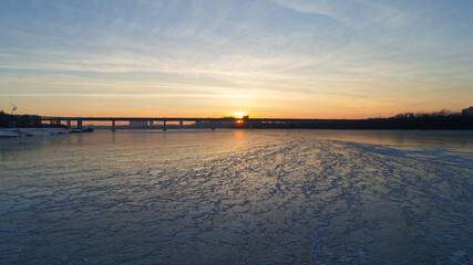 Large body of water with a bridge in the background