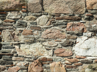 Rustic Stone Wall with Varied Shapes, Colors, and Textures