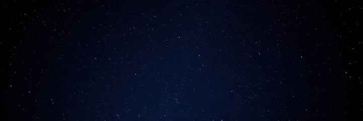 Fototapeta premium Night sky with stars sparkling on a dark blue background, nocturnal sky, deep space