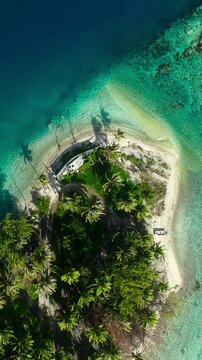 Island near Avatoru Pass famous diving site in the Pacific 4K vertical video.