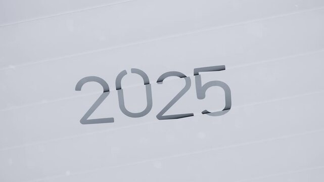 An animated text transitions from 2024 to 2025 on a white background. The line forming the number 4 moves away, while a new line transforms it into 5. Dynamic and minimalist transformation.