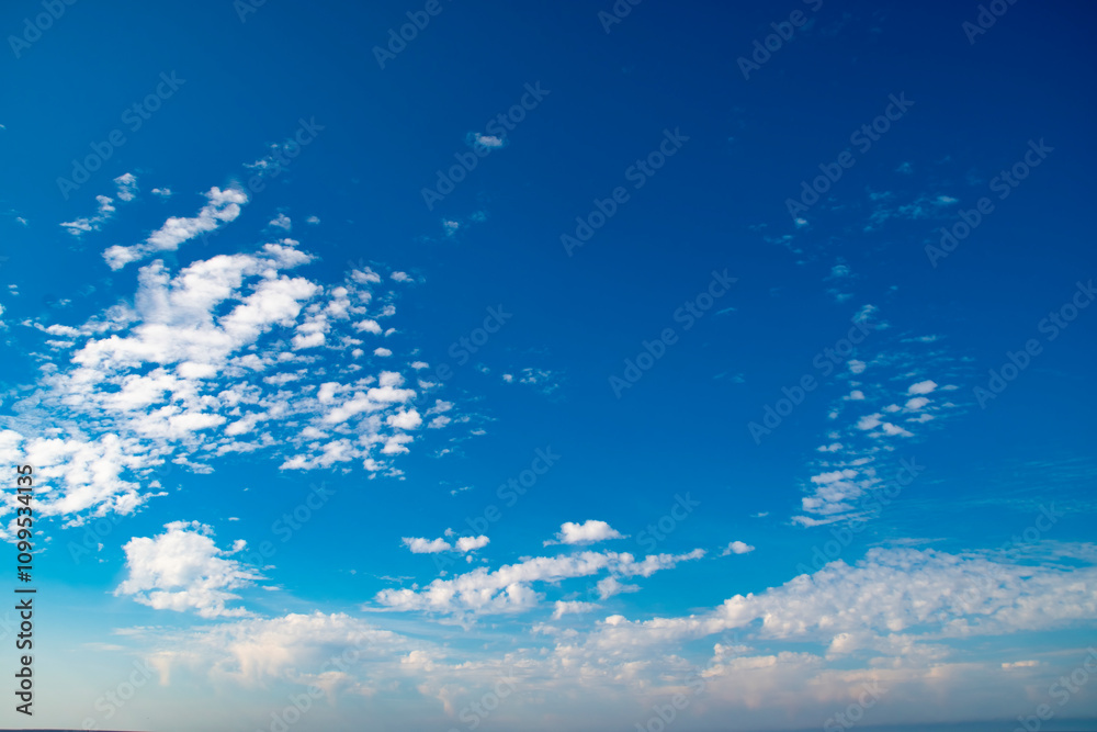 Wall mural background with calm blue sky and white cumulus clouds. relaxing backdrop on the theme of weather an