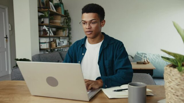 African American university student struggling to write an essay for school
