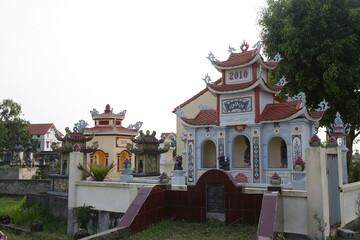 Cemetery near Hanoi city, Vietnam. Traditional national Vietnamese old cemetery. Graves, gravestones and beautiful landscape, scenery. Memorial, buddhist landmark, monument. Asian tradition. Holiday