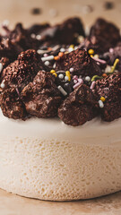 Cream-Based Dessert Topped with Chocolate Pieces and Sprinkles
