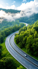 Fototapeta premium Dynamic development of a multilayered flyover highway surrounded by lush green forests nature landscape aerial view infrastructure progress