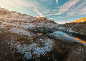 defaultA Young Man Admiring the Spectacular Winter Landscape of the Ibón de los Asnos in Panticosa, Aragon, with Frozen Waters and Snowy Environment, Captured in a Stunning Aerial View of the Aragones