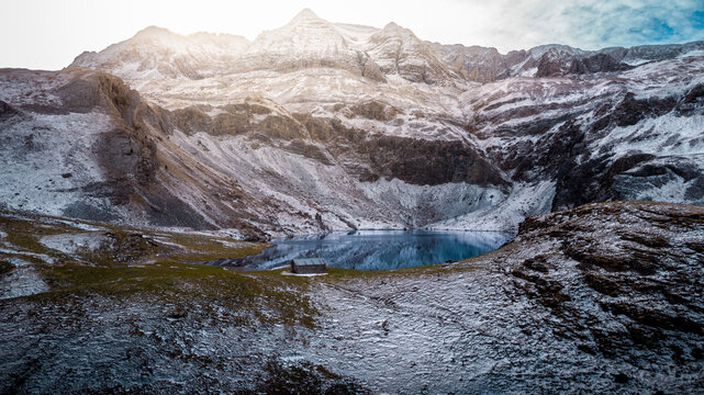 Winter Majesty of the Ib&oacute;n de los Asnos in Panticosa, Aragon: Frozen Waters and Snowy Mountains in the Heart of the Pyrenees Captured from a Drone.
