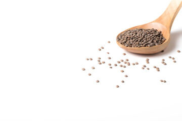 Group of lentils on a wooden spoon on a white background